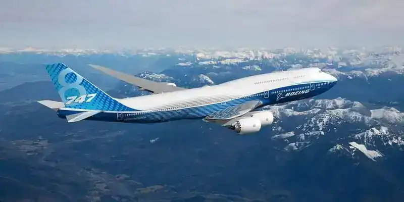 Boeing 747-8 Intercontinental in flight over mountain range