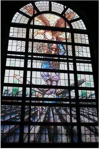 Rolls-Royce Battle of Britain Memorial Window (Hugh Easton, 1949), originally installed in the Marble Hall at Rolls-Royce Nightingale Road, Derby — depicting a figure stood atop a Merlin aero engine propeller with a gold eagle behind, commemorating the contribution of Rolls-Royce engines to the Battle of Britain. Unveiled by Marshal of the RAF Lord Tedder.