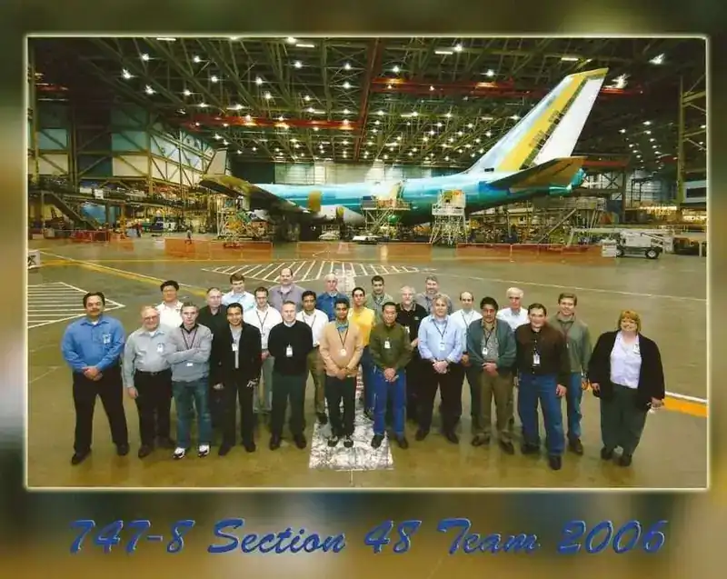 787 Section 48 Team 2006 — Boeing engineering team assembled in front of aircraft in production hangar (Section 48 is the composite aft fuselage section of the 787 Dreamliner)
