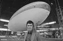 Roger Munk — Founder of Airship Industries with Skyship G-SKSA in hangar behind him
