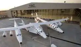 WhiteKnightTwo and SpaceShipTwo mated at The Spaceship Company hangar — rollout with TSC team assembled in front