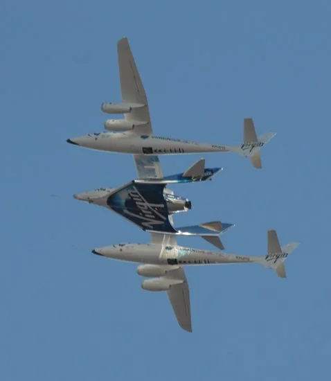WhiteKnightTwo carrier aircraft with SpaceShipTwo mated underneath, in flight