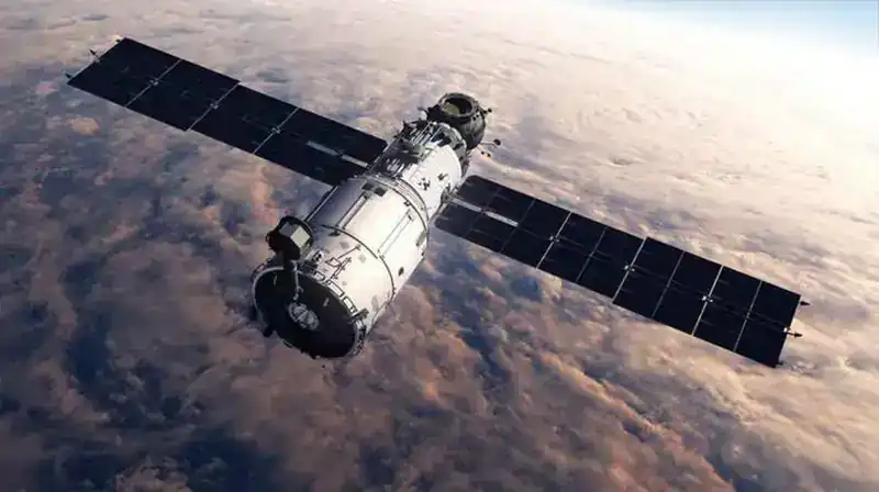 Large satellite with solar panels deployed in low Earth orbit — illustrating the L-SAT solar mast deployment analysis completed by Steve Clamp at Fokker, Schiphol Airport Amsterdam