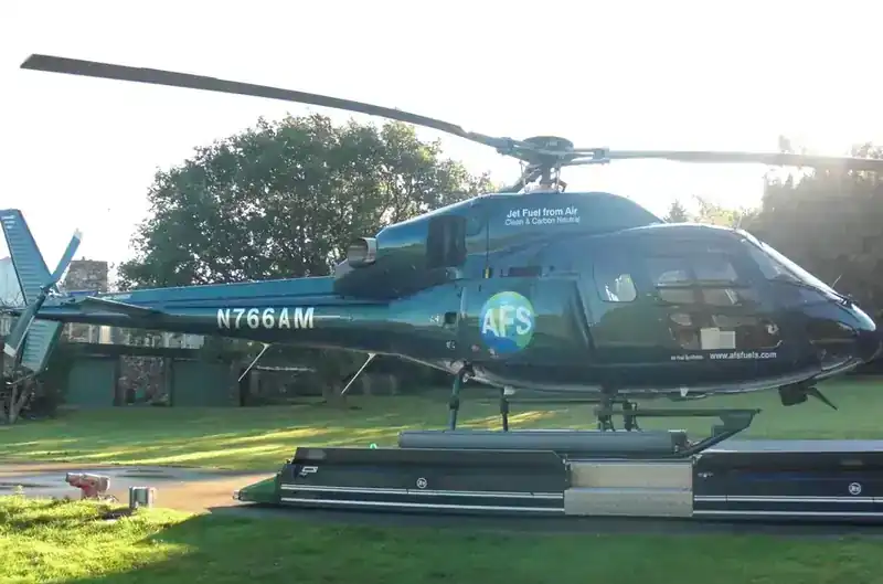 AFS (Air Fuel Synthesis) demonstrator helicopter — Eurocopter AS355 (registration N766AM) painted dark green with 