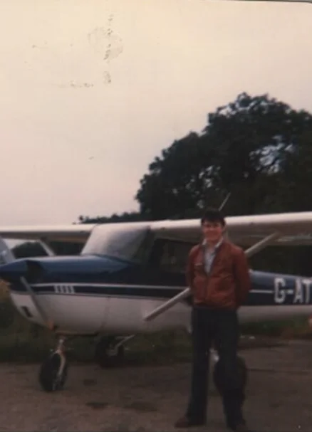 Steve standing beside his first aeroplane, a Cessna 150H, at Cambridge UK