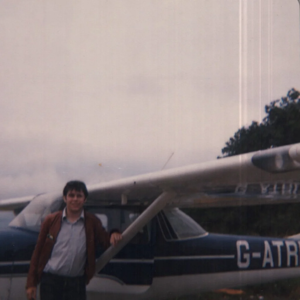Steve leaning on the wing strut of his Cessna 150H at Cambridge UK
